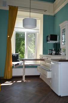 A room with a kitchenette at the Michelle apart-hotel in Odessa. Book a room at a discount.